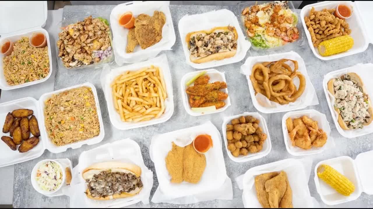 Sauced wings and crispy fries from Dat Wings and Grill