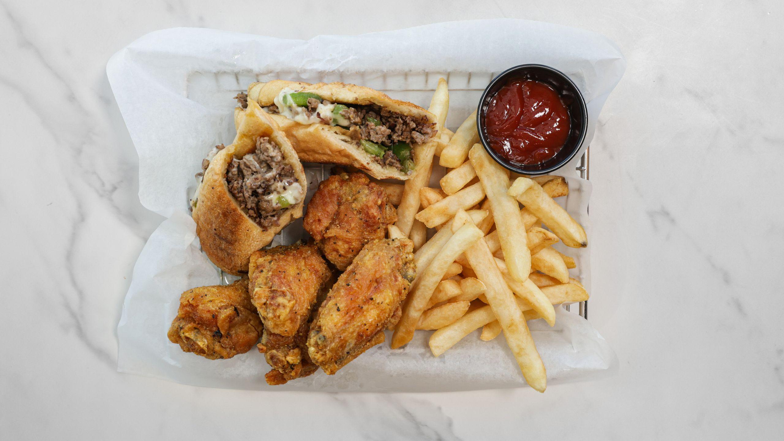 Philly steak and five-piece wing combo with fries
